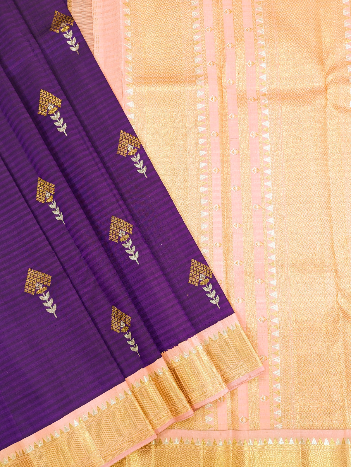 Exquisite Violet Korvai Silk Sari with intricate gold zari weaving.